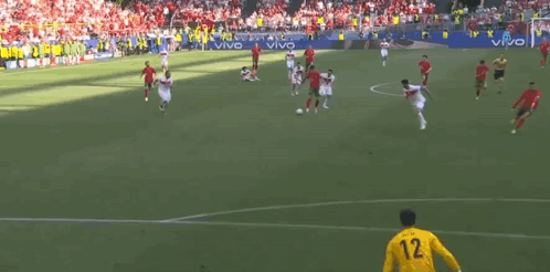 A Soccer Game Is Being Played On A Field With A Goalie Wearing A Yellow Jersey With The Number 20 On It GIF