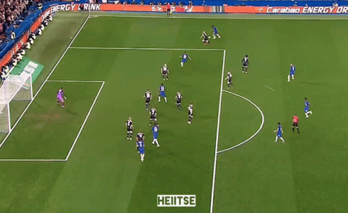 A Soccer Game Is Being Played On A Field With A Sign That Says Heitse GIF