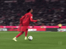 A Soccer Game Is Being Played On A Field With A Sign That Says Meten GIF