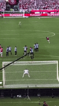 A Soccer Game Is Being Played On A Field With A Superbet Banner In The Background GIF