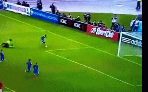 A Soccer Game Is Being Played On A Field With Ads For Coca Cola And Adidas GIF