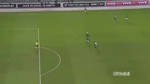 a soccer game is being played on a field with advertisements for gdv football in the background