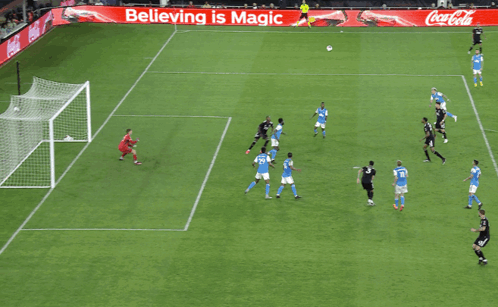 A Soccer Game Is Being Played On A Field With An Advertisement For Coca Cola GIF