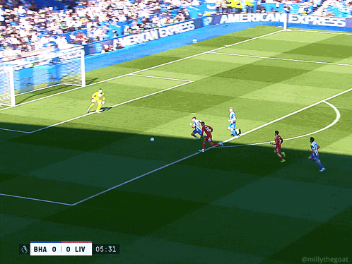 A Soccer Game Is Being Played On A Field With An American Express Banner In The Background GIF