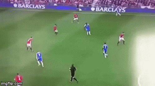 A Soccer Game Is Being Played On A Field With Barclay 'S Advertisements On The Sidelines . GIF