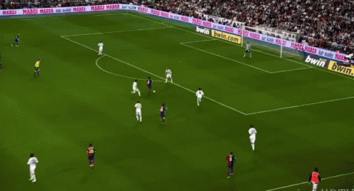 A Soccer Game Is Being Played On A Field With Bwin.com Advertisements On The Sidelines GIF