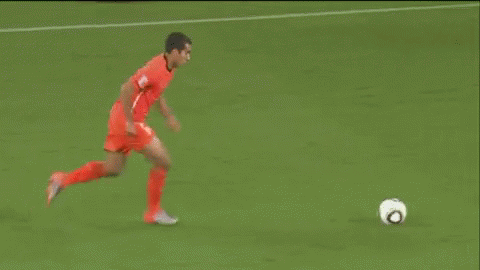 a soccer game is being played on a field with coca cola advertisements