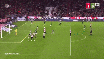 a soccer game is being played on a field with fc bayern advertisements in the background