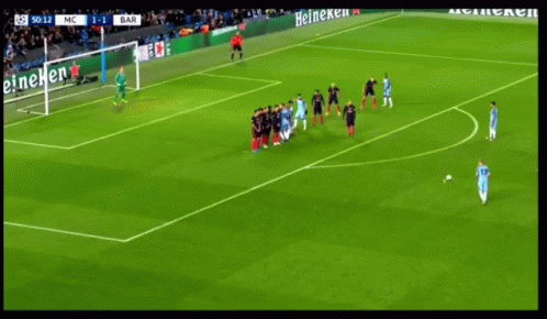 A Soccer Game Is Being Played On A Field With Heineken Ads GIF