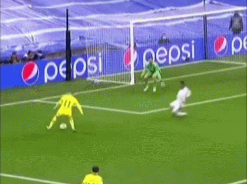 a soccer game is being played on a field with pepsi ads in the background