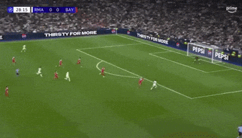 a soccer game is being played on a field with pepsi advertisements