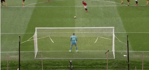 A Soccer Game Is Being Played On A Field With Players In Yellow And Black Jerseys GIF