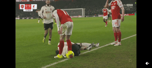 a soccer game is being played with the score 0-0