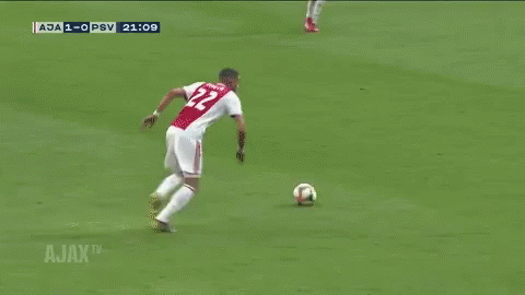 A Soccer Goalie Is Diving To Catch A Ball During A Match Between Ajax And Psv GIF