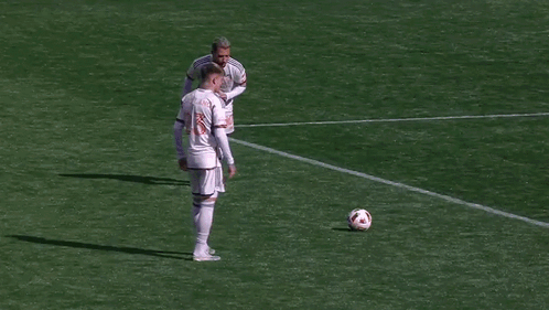 A Soccer Goalie Is Diving To Catch A Ball In Front Of A Target Sign GIF