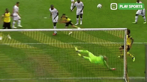 A Soccer Goalie Is Diving To Catch A Soccer Ball During A Game Sponsored By Play Sports . GIF