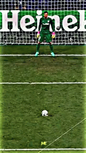 A Soccer Goalie Stands In Front Of A Heineken Advertisement GIF