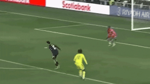 A Soccer Goalie Stands In Front Of A Lowe 'S Sign GIF