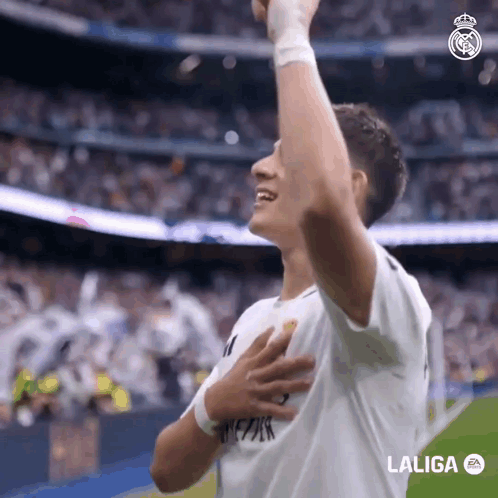 A Soccer Player Celebrates A Goal With His Hands In The Air Sponsored By Laliga GIF