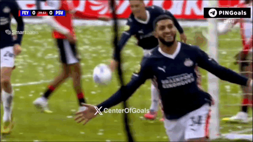 a soccer player celebrates after scoring a goal during a game sponsored by center of goals