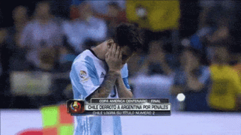 A Soccer Player Covering His Face With His Hands During A Soccer Game GIF