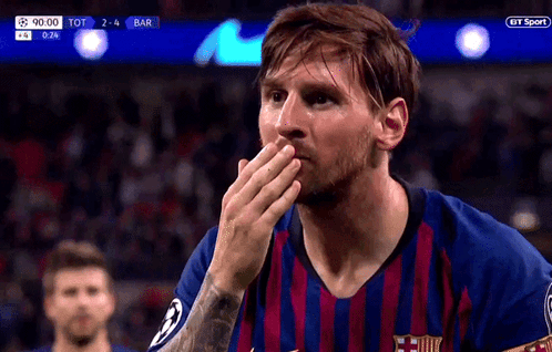 a soccer player covering his mouth with his hand during a bt sport game