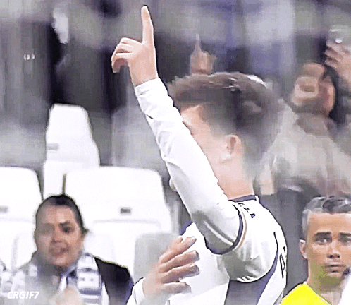 A Soccer Player Giving A Thumbs Up In Front Of The Crowd GIF
