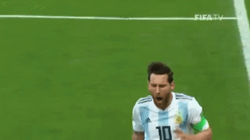 A Soccer Player In A Blue And White Striped Shirt Is Kneeling On The Field With His Arms Outstretched . GIF