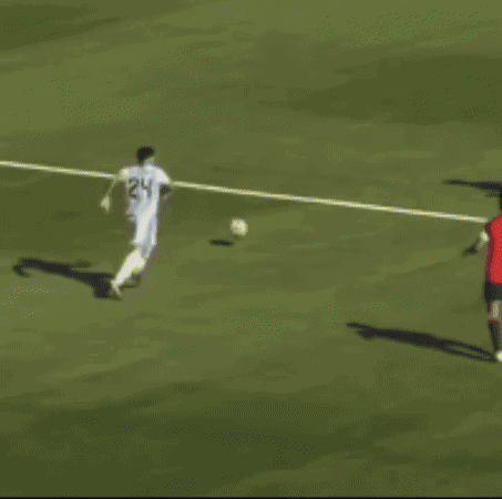 a soccer player in a blue jersey with the number 2 on it