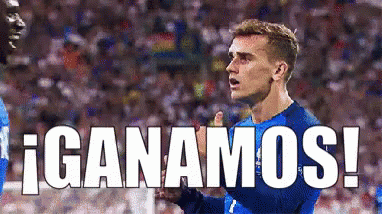 a soccer player in a blue jersey with the word ganamos written below him