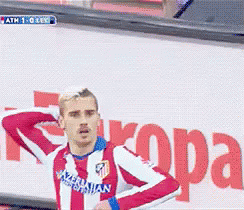 A Soccer Player In A Red And White Uniform With The Word Azerbaijan On The Front GIF