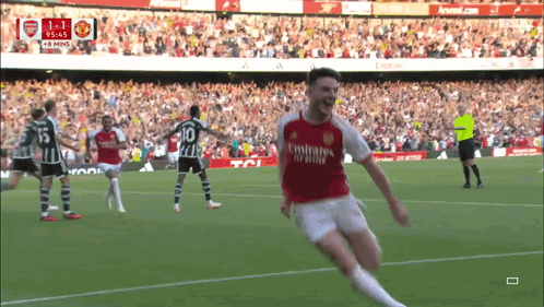 A Soccer Player In A Red Emirates Jersey Celebrates His Goal GIF