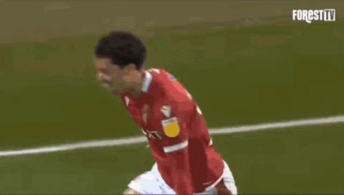 A Soccer Player In A Red Jersey Celebrates His Goal GIF