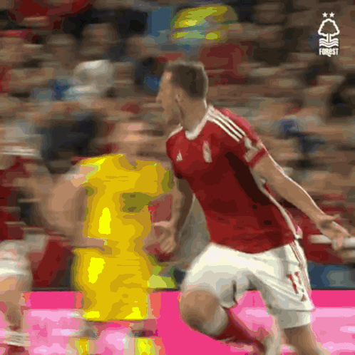 A Soccer Player In A Red Jersey With The Number 11 On It GIF