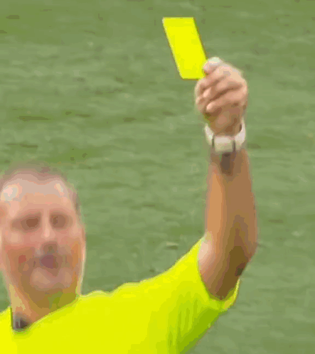 A Soccer Player In A Red Shirt Is Getting A Yellow Card GIF