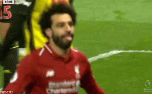 A Soccer Player In A Red Shirt With The Number 15 On His Jersey GIF