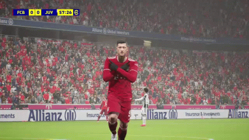 A Soccer Player In A Red Uniform Is Running On The Field GIF