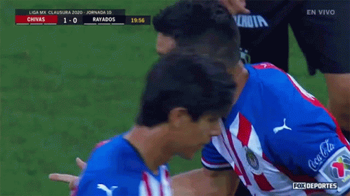 A Soccer Player In A Red White And Blue Uniform Is Being Congratulated GIF