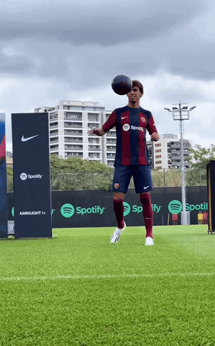 A Soccer Player In A Spotify Jersey Kicks A Ball GIF