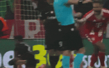 a soccer player in a t-mobile jersey is being tackled