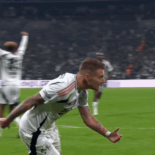 A Soccer Player In A White Jersey With The Number 11 On It GIF