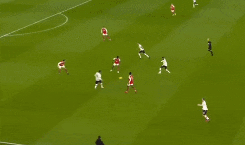 A Soccer Player In A White Shirt Is Running On The Field . GIF