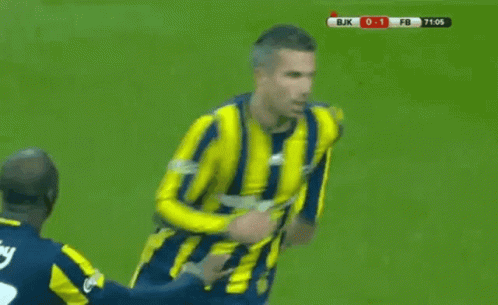 a soccer player in a yellow and blue striped shirt is being tackled by another player on the field .