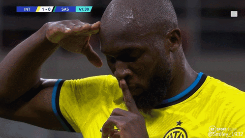 A Soccer Player In A Yellow Jersey Holds His Finger To His Nose GIF