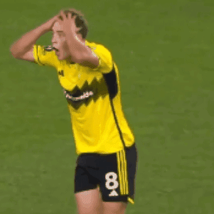 A Soccer Player In A Yellow Jersey With The Number 19 On The Back GIF