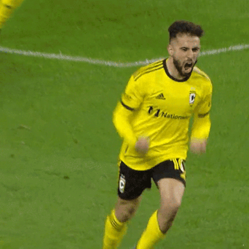 A Soccer Player In A Yellow Jersey With The Number 20 On It GIF