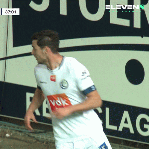 A Soccer Player In Front Of A Sign That Says " Eleven " GIF