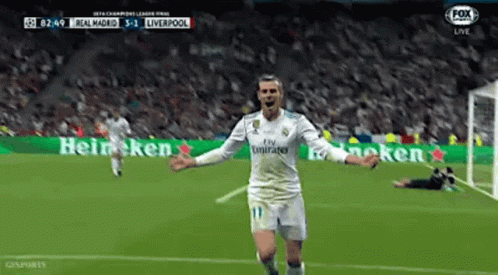 A Soccer Player Is Celebrating A Goal During A Game . GIF