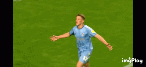 A Soccer Player Is Celebrating A Goal On The Field GIF