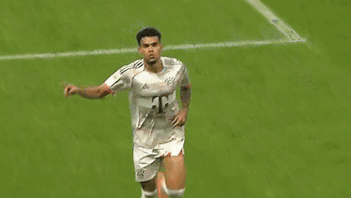 A Soccer Player Is Celebrating A Goal On The Field While Wearing A White Jersey . GIF